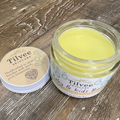 Baby and kids balm in a 2 oz glass jar. Rich in butters and in a salve form. Great for eczema, rashes, irritations and dry skin.