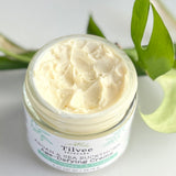 Argan and Seabuckthorn age defying creme is a natural, creamy creme in a glass jar with a sea glass and white label with botanical drawing representing sea buckthorn plants. All natural, no synthetic chemicals and pure plant based ingredients to soften, diminish the appearance of fine lines and wrinkles as well and brighten up dull, saggy, aged looking skin.