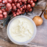 Argan and Seabuckthorn age defying creme is a natural, creamy creme in a glass jar with a sea glass and white label with botanical drawing representing sea buckthorn plants. All natural, no synthetic chemicals and pure plant based ingredients to soften, diminish the appearance of fine lines and wrinkles as well and brighten up dull, saggy, aged looking skin. 
