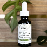 CBD 200 mg Anti-Aging Facial Serum in 1 ounce cobalt blue bottle.  Made with full spectrum CBD from organic industrial grown hemp. Key ingredients include COQ10, Prickly Pear Oil, Squalane and Blue Tansy Oil. 